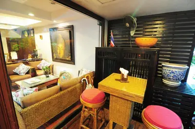 a living room with a couch and a table at Baan Sukhumvit Soi 20 in Bangkok