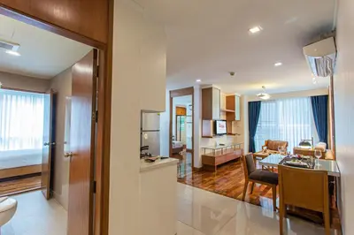 a room with a kitchen and a living room at D Varee Montara Thonglor 25 in Bangkok