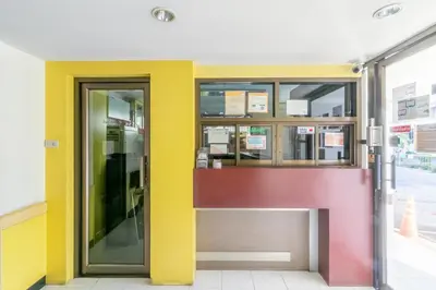an entrance to a building with colorful doors at MS Mansion in Bangkok
