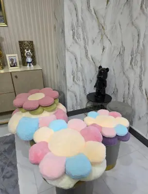 a room with a group of chairs with flowers at 51 Suanplu Residence in Bangkok