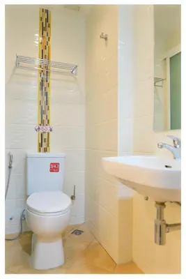 a bathroom with a white toilet and a sink at 4M Pratunam Hotel in Bangkok