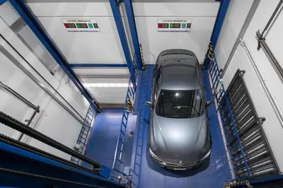 a car is parked in a train station at Samyan Serene Hotel in Bangkok
