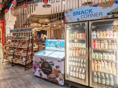 a grocery store with a display of soft drinks at VELA Dhi GLOW Pratunam in Bangkok