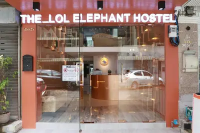 a store front with a sign that reads the job elephant hospital at The LOL Elephant Hostel in Bangkok