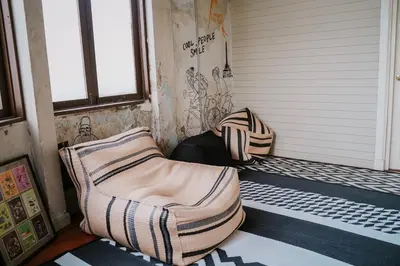 two bean bag chairs sitting on a porch at Azure Hostel Bangkok in Bangkok