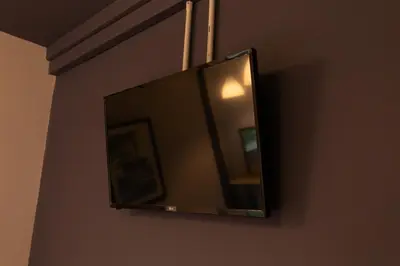 a mirror hanging on a wall in a room at Mango 10 House in Bangkok