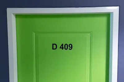 a green door with the number on it at Mango 10 House in Bangkok