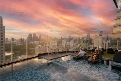 a rendering of a rooftop pool with a city skyline at The Continent Hotel Sukhumvit - Asok BTS Bangkok in Bangkok