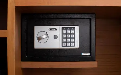 a remote control in a drawer of a cabinet at Sukhon Hotel - SHA Plus in Bangkok