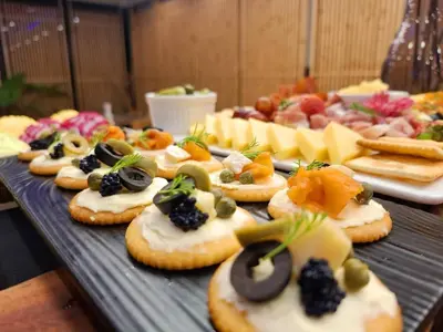 a bunch of appetizers on a table with appetizers at Arize Hotel Sukhumvit in Bangkok