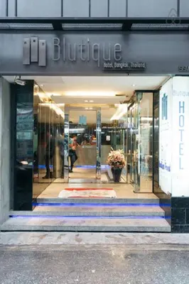a store front of a building with a sign on it at Blutique Hotel in Bangkok
