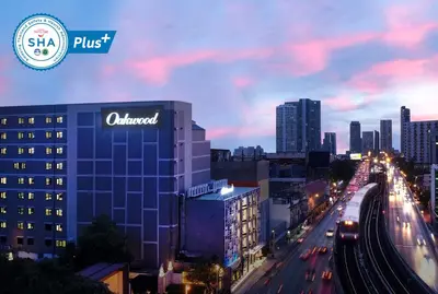a view of a city at night with cars at Oakwood Hotel & Residence Bangkok in Bangkok