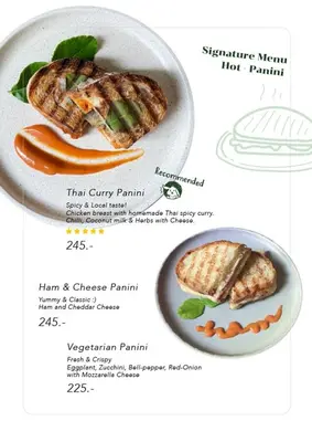 a plate of food with a sandwich and vegetables at Better Moon Guesthouse in Bangkok