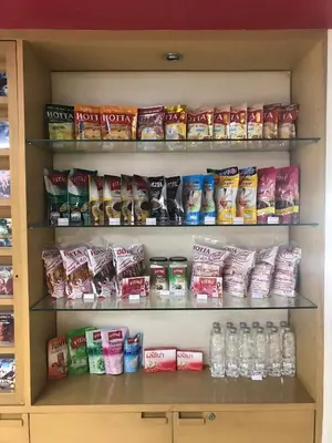 a pantry filled with lots of different types of food at De Junction House in Bangkok
