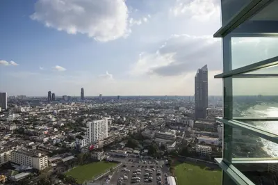 a view of a city from a building at Chatrium Hotel Riverside Bangkok in Bangkok