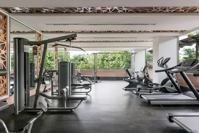 a gym with cardio machines and treadmills at Adelphi Grande Sukhumvit in Bangkok