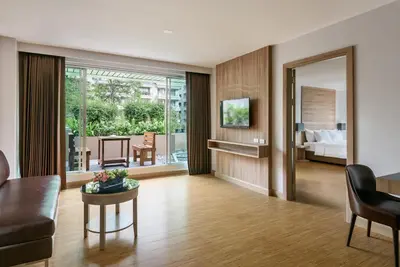 a living room with a couch and a table at Adelphi Grande Sukhumvit in Bangkok