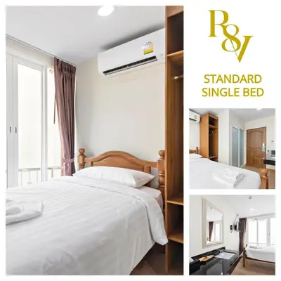 a bedroom with a white bed and a window at Royale 8 Ville Guest House in Bangkok