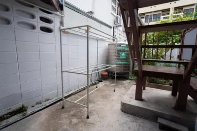 a room with a metal rack in a building at Dunah's Garden Home in Bangkok