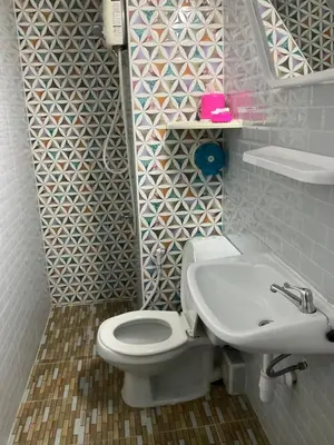 a bathroom with a white toilet and a sink at Dailyroom C3,C4by Anna in Nonthaburi