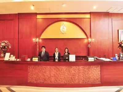 a group of people sitting at a reception desk at The Ecotel Bangkok in Bangkok