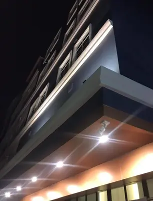 a building with lights on top of it at night at 43 Home in Bangkok Noi