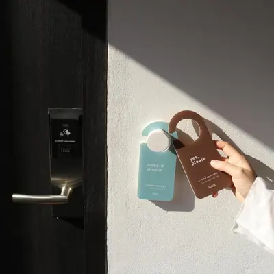 a person is holding a lock on a door at Chocolate box mint in Bangkok