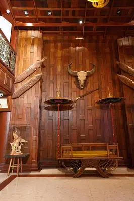 a room with a cow skull on a wooden wall at Chang Siam Inn in Bangkok