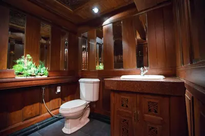 a bathroom with a toilet and a sink at Chang Siam Inn in Bangkok