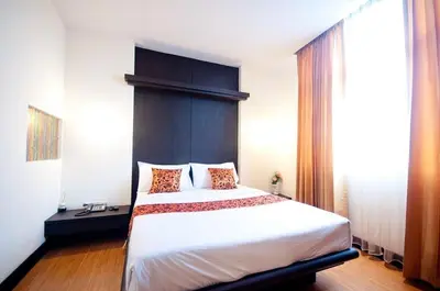 a bedroom with a large bed in a room at Siam Paradise Entertainment Complex in Bangkok