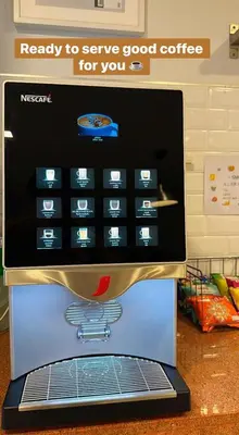 a computer screen of a microwave with the words ready to serve good coffee at Rich8 Hostel in Bangkok
