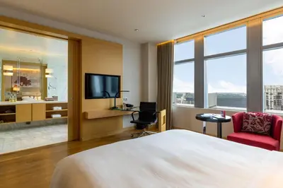 a hotel room with a bed and a television at Bangkok Marriott Hotel Sukhumvit in Bangkok