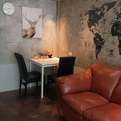 a living room with a couch and a table at V30 Sukhumvit in Bangkok