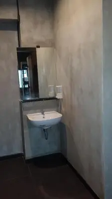a bathroom with a sink and a mirror at bangkok bed place in Bangkok