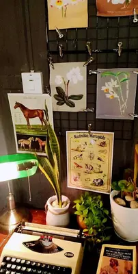 a desk with a computer keyboard and a plant on it at Nego Home Ancient Inn in Bangkok