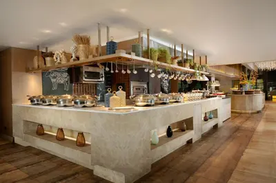 a kitchen with a counter with pots and pans at Avani Ratchada Bangkok in Bangkok