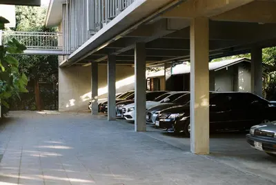 a row of cars parked in a parking lot at SUNKISS in Bangkok Noi