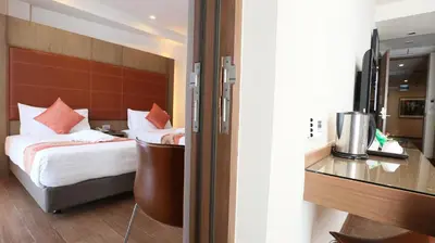 a bedroom with a bed and a desk in a room at On 8 Sukhumvit Nana Bangkok in Bangkok