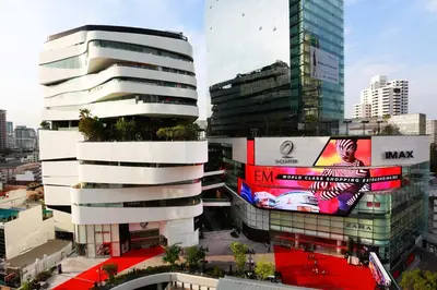 a tall white building with a sign on the side of it at On 8 Sukhumvit Nana Bangkok in Bangkok