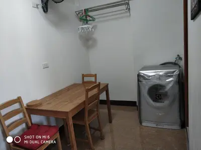 a table and chairs and a trash can in a room at 18floor condo close to MRTwith 2 bedrooms in Hua mak in Bangkok