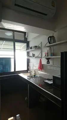 a kitchen with a counter with a sink and a window at 18floor condo close to MRTwith 2 bedrooms in Hua mak in Bangkok