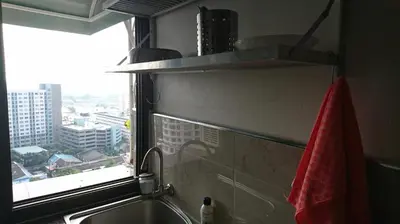 a kitchen with a sink and a window with a view at 18floor condo close to MRTwith 2 bedrooms in Hua mak in Bangkok
