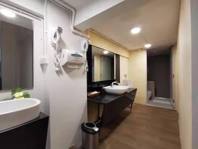 a bathroom with two sinks and a large mirror at A Bangkok Journey in Bangkok