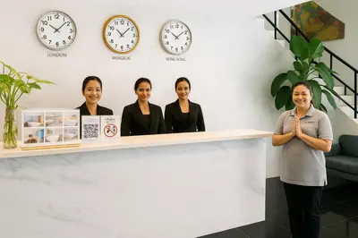 a group of women standing behind a counter at PACIFIC RESIDENCE 39 in Bangkok