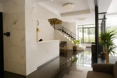 a staircase in a house with a lobby at PACIFIC RESIDENCE 39 in Bangkok