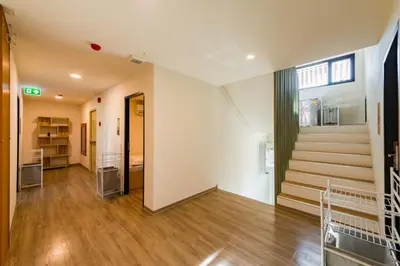 an empty room with a staircase and a stair case at P18 Hotel Bangkok in Bangkok