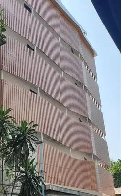 a tall building with orange and white at P18 Hotel Bangkok in Bangkok