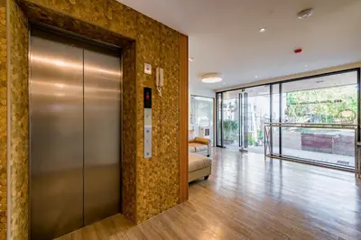 a lobby with a elevator in a building at P18 Hotel Bangkok in Bangkok