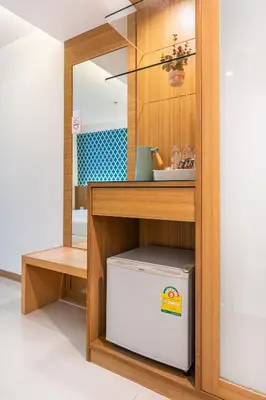 a kitchen with a counter with a cooler under a shelf at P2 Boutique in Bangkok