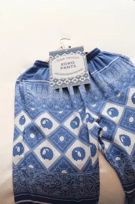 a blue and white shirt with a tag on it at Kokotel Bangkok Dheva Thonglor in Bangkok